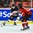 KAMLOOPS, BC - APRIL 1: Japan's Hanae Kubo #21 plays the puck while Switzerland's Laura Benz #21defends during relegation round action at the 2016 IIHF Ice Hockey Women's World Championship. (Photo by Matt Zambonin/HHOF-IIHF Images)

